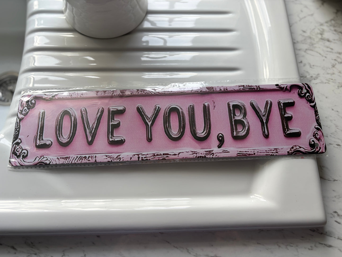 Love You, Bye pink sign